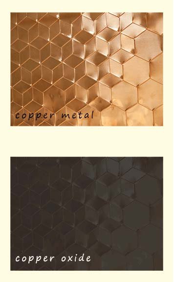 Copper metal heating in air to form copper(II) oxide. No flames are produced, only a colour change from bronze to black.